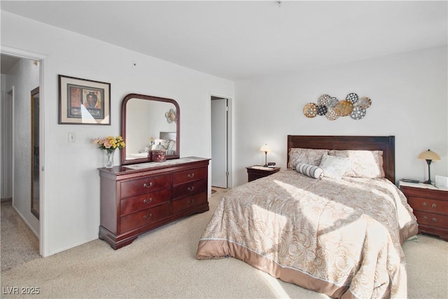 bedroom featuring light carpet