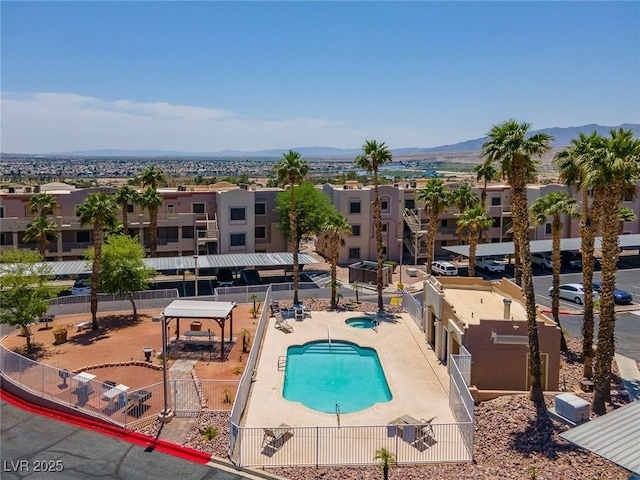 view of swimming pool featuring a mountain view and a patio area