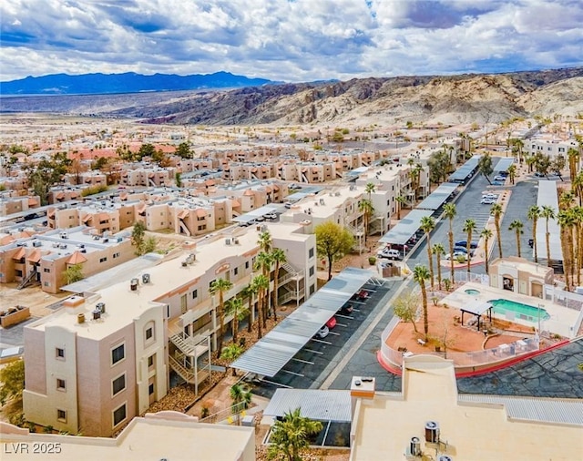 birds eye view of property with a mountain view