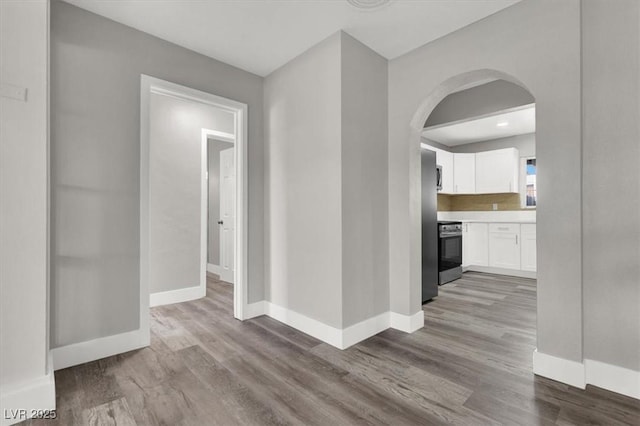 hall with light hardwood / wood-style flooring