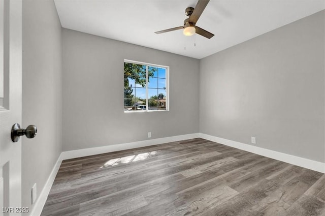 empty room with wood-type flooring and ceiling fan