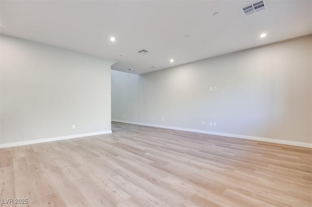 spare room featuring light wood-type flooring