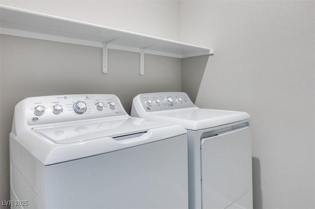 laundry room with independent washer and dryer