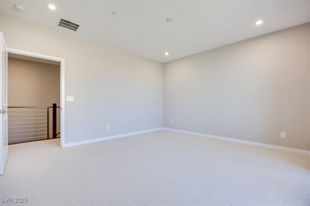 empty room with light colored carpet