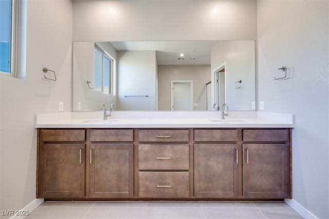 bathroom with vanity and tile patterned flooring