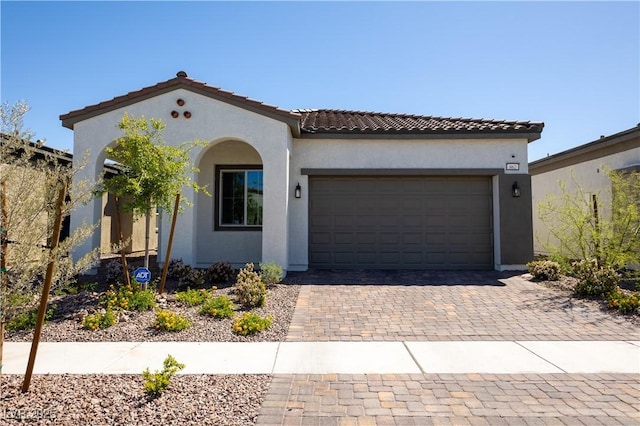 mediterranean / spanish-style house featuring a garage