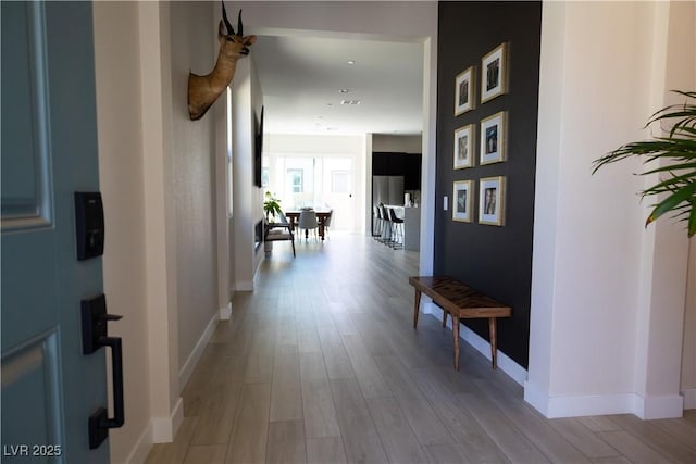 hallway featuring light hardwood / wood-style flooring