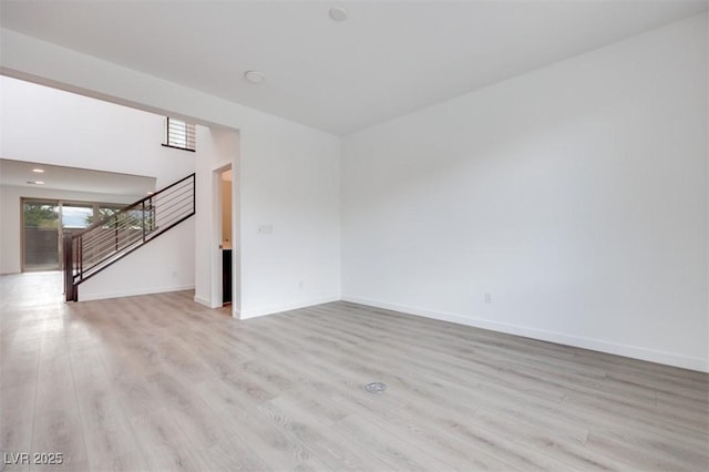 unfurnished room featuring light hardwood / wood-style floors