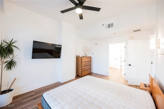 bedroom with ceiling fan and hardwood / wood-style floors