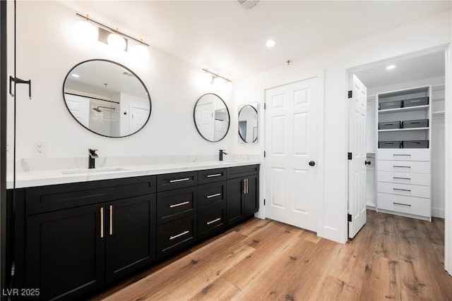 bathroom featuring wood-type flooring and vanity