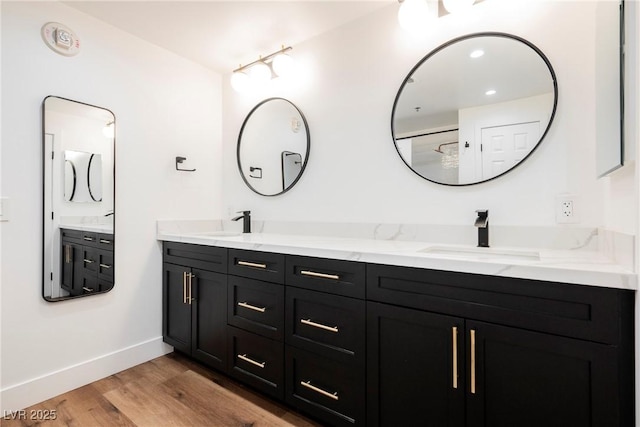 bathroom featuring vanity and hardwood / wood-style floors