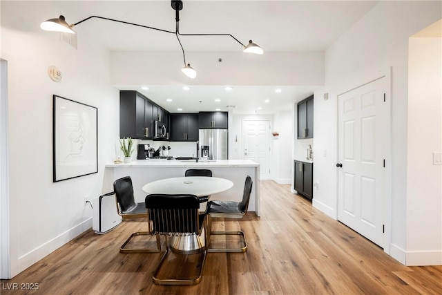 dining room featuring light wood-type flooring