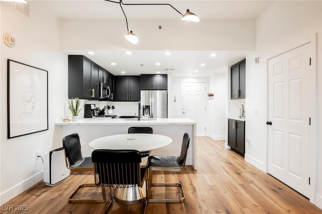 dining room featuring light wood-type flooring