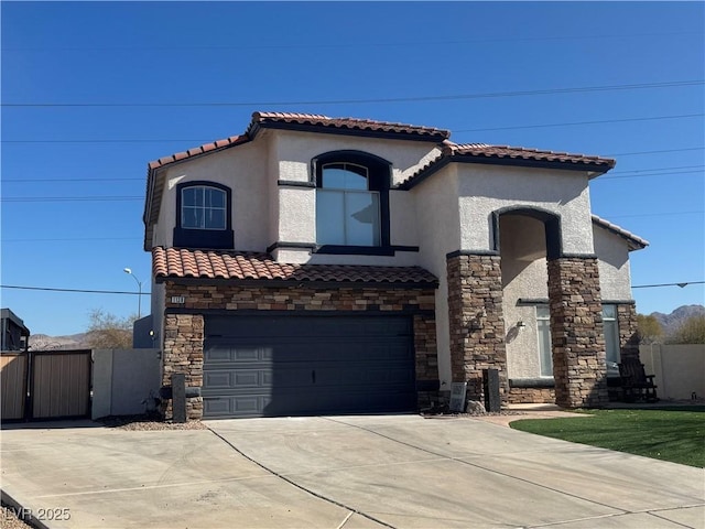 mediterranean / spanish-style house with a garage