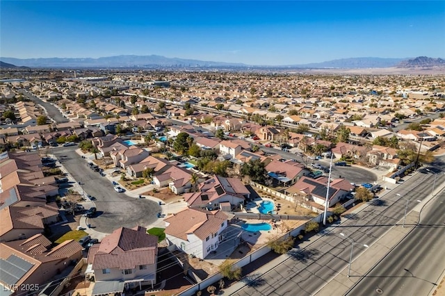 birds eye view of property featuring a mountain view