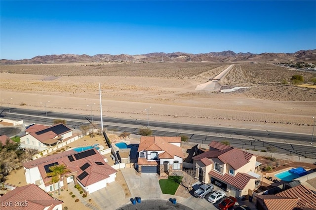 drone / aerial view featuring a mountain view