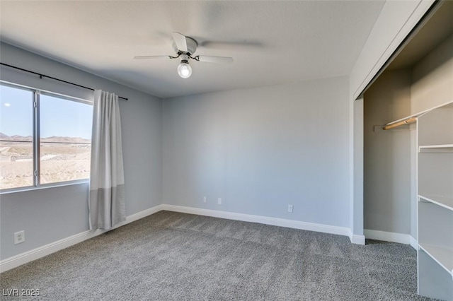 unfurnished bedroom featuring a closet, ceiling fan, and carpet