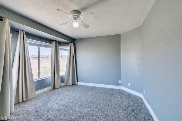 spare room with carpet floors, a textured ceiling, and ceiling fan