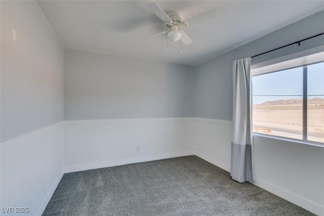 carpeted empty room with ceiling fan