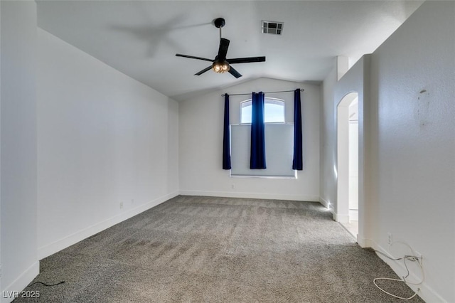 unfurnished room featuring lofted ceiling, ceiling fan, and carpet flooring