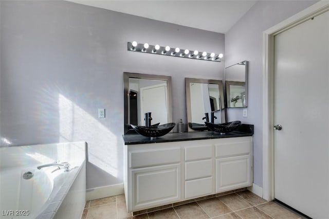 bathroom featuring vanity and a tub to relax in