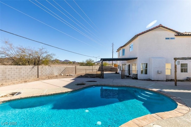 view of swimming pool featuring a patio area and a pergola