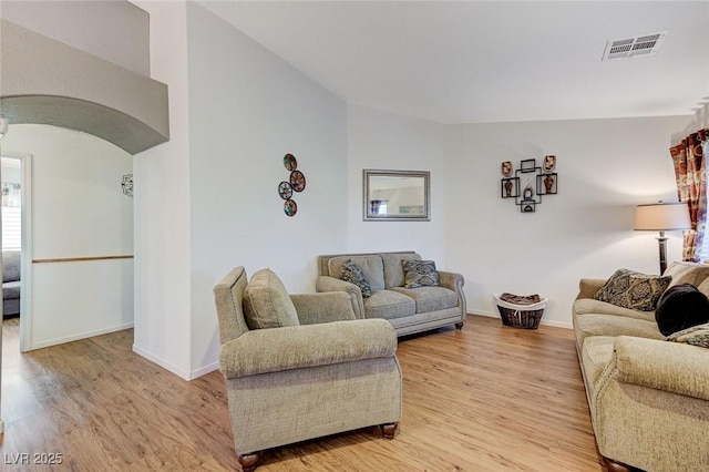 living room with light hardwood / wood-style flooring