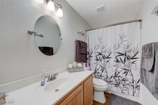 bathroom with vanity, toilet, and a shower with shower curtain