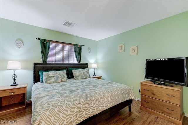 bedroom with wood-type flooring