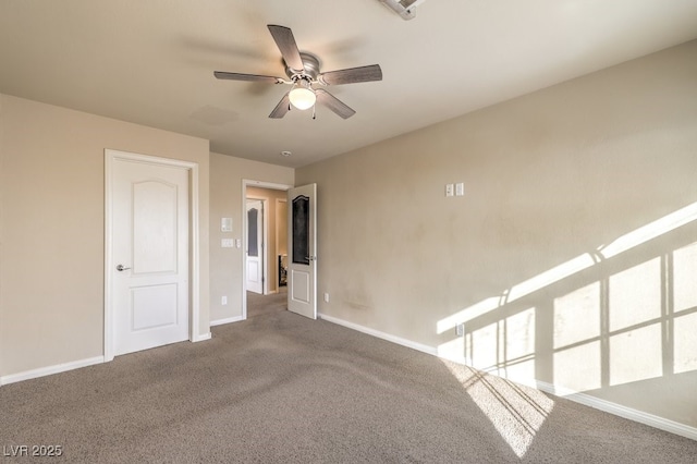 spare room with ceiling fan and carpet flooring