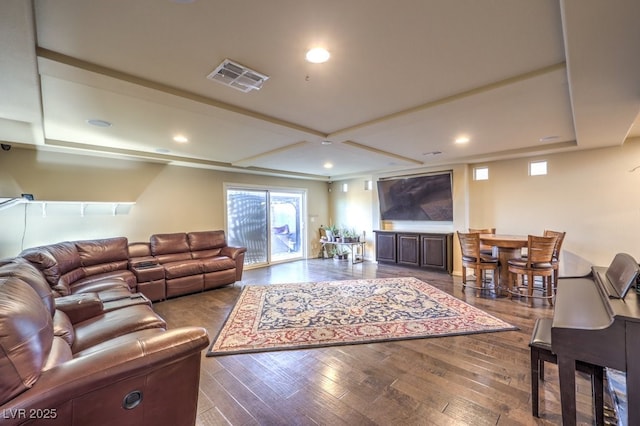 living room featuring wood-type flooring and coffered ceiling