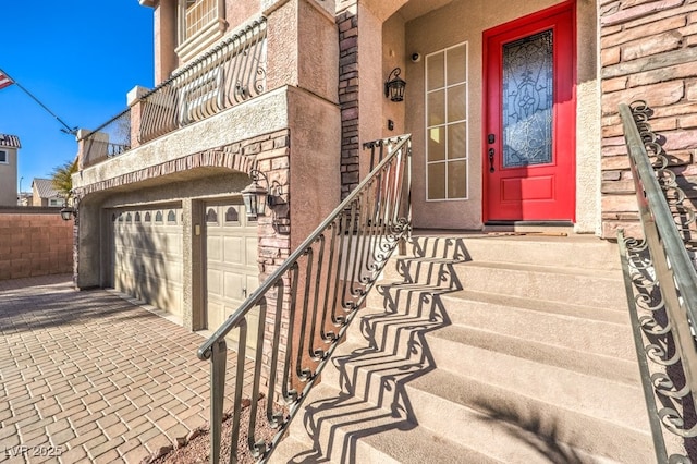 doorway to property with a garage