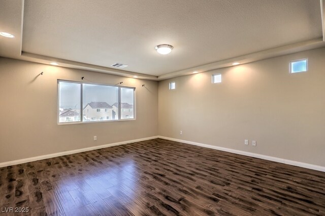 5490 Tulip Hill Ave, Las Vegas, NV 89141 - spare room featuring dark wood-type flooring, baseboards, recessed lighting, and a textured ceiling