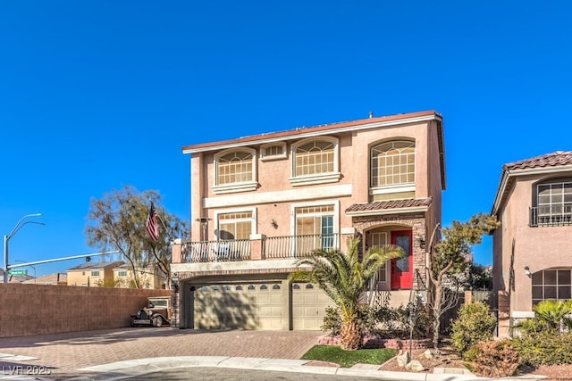 5490 Tulip Hill Ave, Las Vegas, NV 89141 - view of front of home featuring decorative driveway, a garage, stucco siding, and a tile roof
