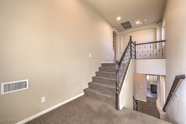 5490 Tulip Hill Ave, Las Vegas, NV 89141 - staircase featuring carpet floors, baseboards, recessed lighting, and arched walkways