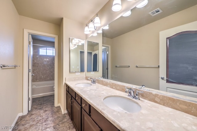 5490 Tulip Hill Ave, Las Vegas, NV 89141 - full bath with double vanity, baseboards, and tub / shower combination