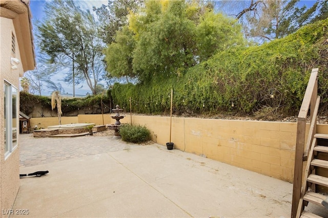 view of patio / terrace with fence