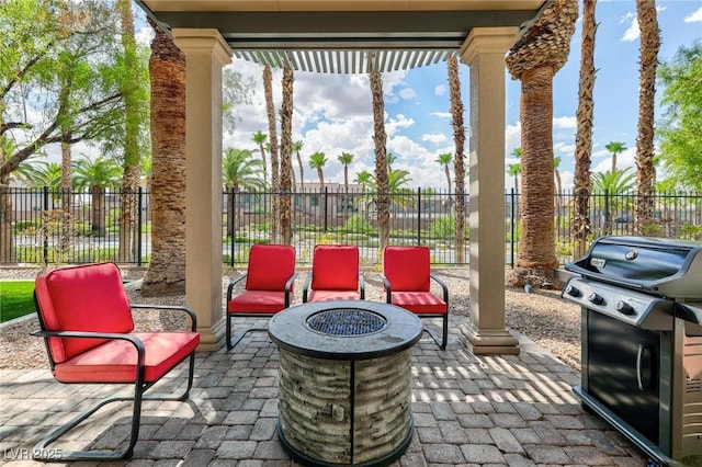 view of patio featuring grilling area and a fire pit