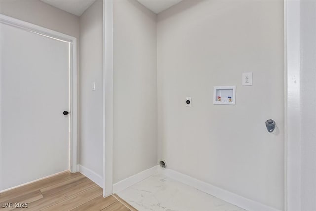 washroom featuring electric dryer hookup, washer hookup, and light hardwood / wood-style flooring