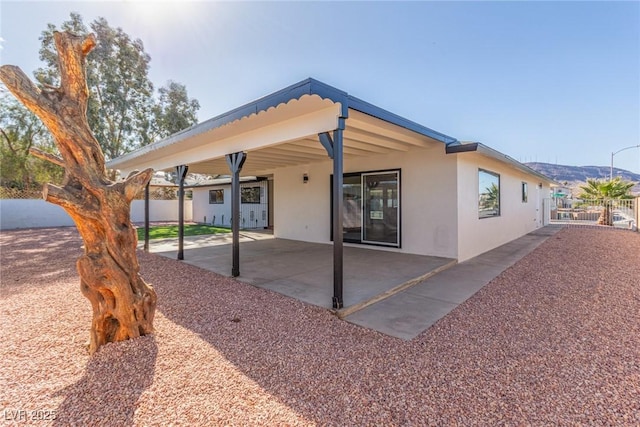 back of property featuring a patio