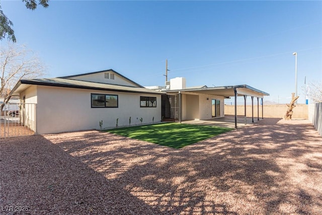 back of house featuring a patio