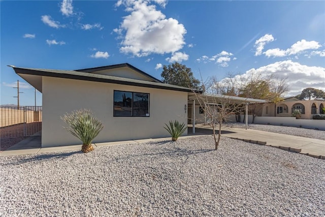 exterior space featuring a carport