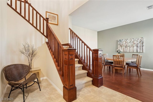 stairway with tile patterned flooring