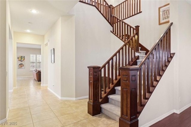 stairway featuring tile patterned flooring