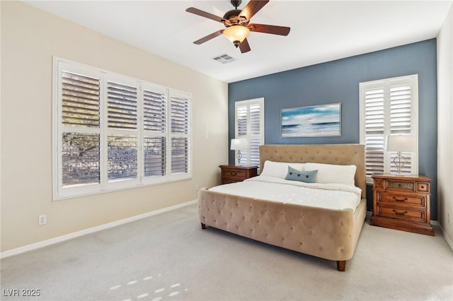 bedroom featuring ceiling fan and light carpet