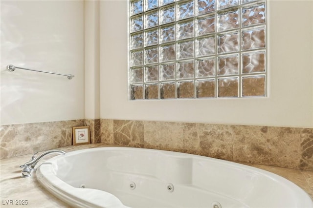 bathroom featuring a relaxing tiled tub