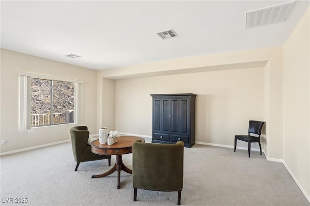 sitting room with light carpet