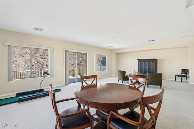 view of carpeted dining area