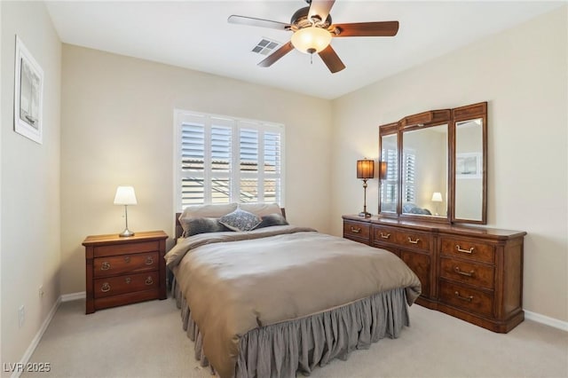 bedroom featuring light colored carpet and ceiling fan