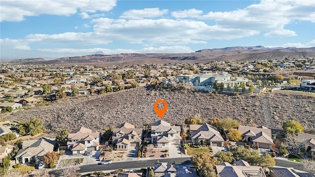 drone / aerial view featuring a mountain view and a residential view